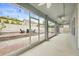 Covered patio with a view of brick paved backyard with outdoor seating and basketball court at 14160 Dove Hollow Dr, Orlando, FL 32824