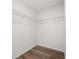 A walk-in closet features wire shelving for efficient storage and organization at 14160 Dove Hollow Dr, Orlando, FL 32824
