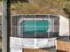 Aerial view of a screened-in pool, offering a serene outdoor oasis at 149 Imperial Oak Ct, Davenport, FL 33896