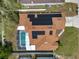Birds-eye view of the home featuring a pool and solar panels, plus the roof, capturing the property layout at 149 Imperial Oak Ct, Davenport, FL 33896