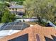 Aerial view of home featuring a screened-in pool, backyard, and solar panels at 149 Imperial Oak Ct, Davenport, FL 33896