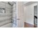 Modern bathroom featuring tiled shower and niche, with neutral colors and glass door at 149 Imperial Oak Ct, Davenport, FL 33896
