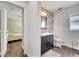 View from bedroom showing bathroom with modern vanity, stylish accents and natural light at 149 Imperial Oak Ct, Davenport, FL 33896