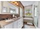 Bathroom featuring double sinks, tub, shower, and a stylish wood-paneled wall at 149 Imperial Oak Ct, Davenport, FL 33896