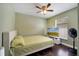 Cozy bedroom with natural light, ceiling fan, and warm, inviting decor at 149 Imperial Oak Ct, Davenport, FL 33896
