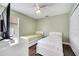 Comfortable bedroom featuring twin beds, lots of natural light, and ceiling fan at 149 Imperial Oak Ct, Davenport, FL 33896