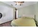 Comfortable bedroom featuring neutral walls, ceiling fan, and ample closet space at 149 Imperial Oak Ct, Davenport, FL 33896