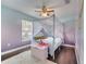 Charming bedroom with whimsical decor, canopy bed and plush rug for a magical retreat at 149 Imperial Oak Ct, Davenport, FL 33896