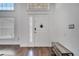 Bright foyer with hardwood floors and a view to the living room at 149 Imperial Oak Ct, Davenport, FL 33896