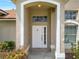 Close-up of the front door, showcasing the entrance and porch at 149 Imperial Oak Ct, Davenport, FL 33896