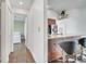 Hallway leading to a dining area with bar seating and a view of the bedroom at 149 Imperial Oak Ct, Davenport, FL 33896