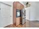 This kitchen offers a built-in oven, stainless steel fridge, and great natural light at 149 Imperial Oak Ct, Davenport, FL 33896