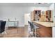 Kitchen with granite counters, stainless steel appliances, and bar seating with modern fixtures at 149 Imperial Oak Ct, Davenport, FL 33896