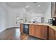 Bright kitchen featuring wood cabinets, granite countertops, stainless appliances, and great natural light at 149 Imperial Oak Ct, Davenport, FL 33896