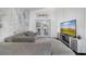 Comfortable living room with a gray sofa, entertainment center, and view of the pool at 149 Imperial Oak Ct, Davenport, FL 33896
