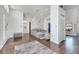 Open-concept living room with a modern gray sofa and accent marble wallpaper at 149 Imperial Oak Ct, Davenport, FL 33896