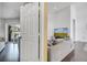 View from doorway of living room with sofa and view of pool from sliding door at 149 Imperial Oak Ct, Davenport, FL 33896