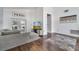 Cozy living room with a gray sofa, TV, and access to other areas of the home at 149 Imperial Oak Ct, Davenport, FL 33896