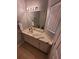 Bathroom area features a mirror, vanity, and window with great lighting at 153 Pompano Beach Dr Dr, Kissimmee, FL 34746
