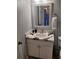 Bathroom vanity features decorative mirror and unique black and white countertop at 153 Pompano Beach Dr Dr, Kissimmee, FL 34746