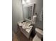 Bathroom featuring vanity with modern countertop and decorative mirror and toilet at 153 Pompano Beach Dr Dr, Kissimmee, FL 34746