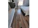 Bedroom showcases modern laminate flooring and bright window with curtains at 153 Pompano Beach Dr Dr, Kissimmee, FL 34746