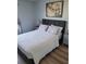 Tastefully decorated bedroom featuring modern furniture and a relaxing atmosphere at 153 Pompano Beach Dr Dr, Kissimmee, FL 34746