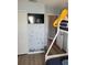 Charming bedroom with TV, marine wall art, and a view into the hallway at 153 Pompano Beach Dr Dr, Kissimmee, FL 34746