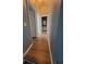 Upstairs hallway featuring attractive and durable wood-look laminate flooring at 153 Pompano Beach Dr Dr, Kissimmee, FL 34746