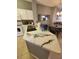 This kitchen features stainless appliances, tile backsplash and marbled countertops with barstool seating at 153 Pompano Beach Dr Dr, Kissimmee, FL 34746
