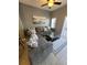 Living room area with tile flooring, great lighting, and a gray L-shaped couch at 153 Pompano Beach Dr Dr, Kissimmee, FL 34746