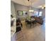 Open concept kitchen, dining, and living room area with tile flooring and great lighting at 153 Pompano Beach Dr Dr, Kissimmee, FL 34746
