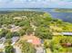 Wide aerial showcases waterfront home, serene views, and lovely established community at 1654 Marina Lake Dr, Kissimmee, FL 34744
