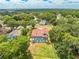 High-angle view of a single Gathering home with a screened pool in a lush, green neighborhood at 1654 Marina Lake Dr, Kissimmee, FL 34744