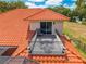 Balcony with chair and table set offering a relaxing outdoor space off the main house at 1654 Marina Lake Dr, Kissimmee, FL 34744