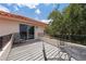 Outdoor balcony with seating area, overlooking green trees, with terracotta roofing at 1654 Marina Lake Dr, Kissimmee, FL 34744