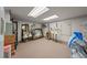 Spacious storage basement features carpeted floors, shelving, and fluorescent lighting at 1654 Marina Lake Dr, Kissimmee, FL 34744