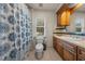 Bathroom featuring a shower/tub combo, toilet and vanity at 1654 Marina Lake Dr, Kissimmee, FL 34744