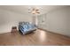 Bright bedroom with wood floors, a ceiling fan, and a window seat with shutters at 1654 Marina Lake Dr, Kissimmee, FL 34744