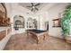 Bright billiard room with a pool table, tile floors, and elegant décor at 1654 Marina Lake Dr, Kissimmee, FL 34744