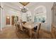 A formal dining room with tile floors, a coffered ceiling, and an archway to other rooms at 1654 Marina Lake Dr, Kissimmee, FL 34744