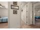Bright hallway with travertine floors leads to bedrooms and bathrooms at 1654 Marina Lake Dr, Kissimmee, FL 34744