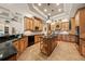 Spacious kitchen with custom wood cabinets, granite counters, and center island at 1654 Marina Lake Dr, Kissimmee, FL 34744