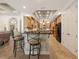 The kitchen features stainless steel appliances, wood cabinetry, and a tiled island with seating at 1654 Marina Lake Dr, Kissimmee, FL 34744