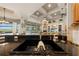 Kitchen sink view of the open living space and outdoor pool at 1654 Marina Lake Dr, Kissimmee, FL 34744