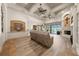 A spacious living room featuring tile floors, a fireplace, and views of the backyard pool at 1654 Marina Lake Dr, Kissimmee, FL 34744