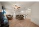 Comfortable living room with wood floors, a ceiling fan, and neutral decor at 1654 Marina Lake Dr, Kissimmee, FL 34744