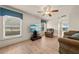Bright living room with lots of natural light, ceiling fan and comfortable seating at 1654 Marina Lake Dr, Kissimmee, FL 34744