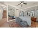 Spacious main bedroom with mirrored walls, ceiling fan, and plush rug at 1654 Marina Lake Dr, Kissimmee, FL 34744