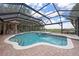 Backyard swimming pool and spa under a screened enclosure at 1654 Marina Lake Dr, Kissimmee, FL 34744